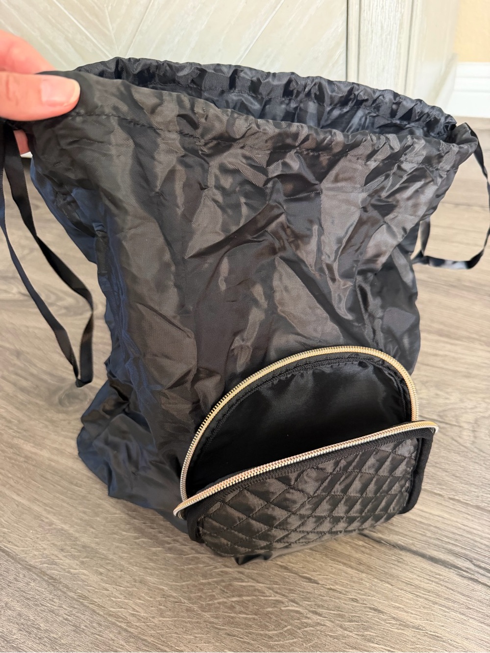 Black Drawstring Bag that Folds into Quilted Pocket
